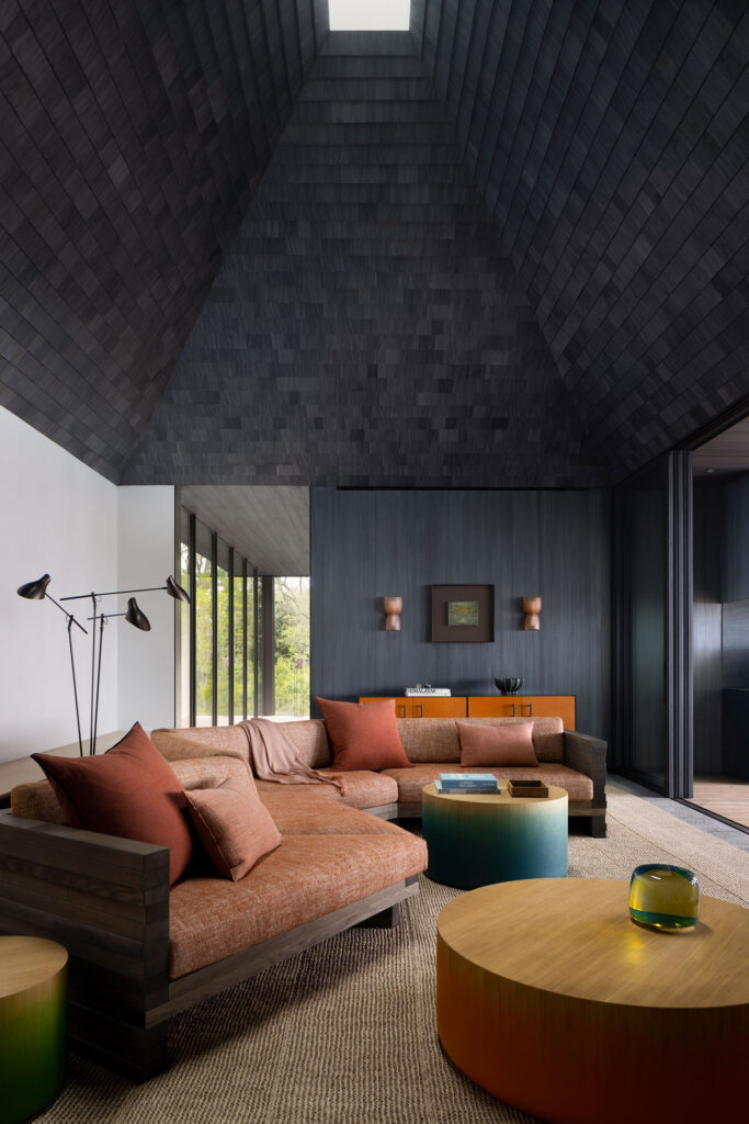 The Bay House — vaulted den with shingled ceiling and skylight