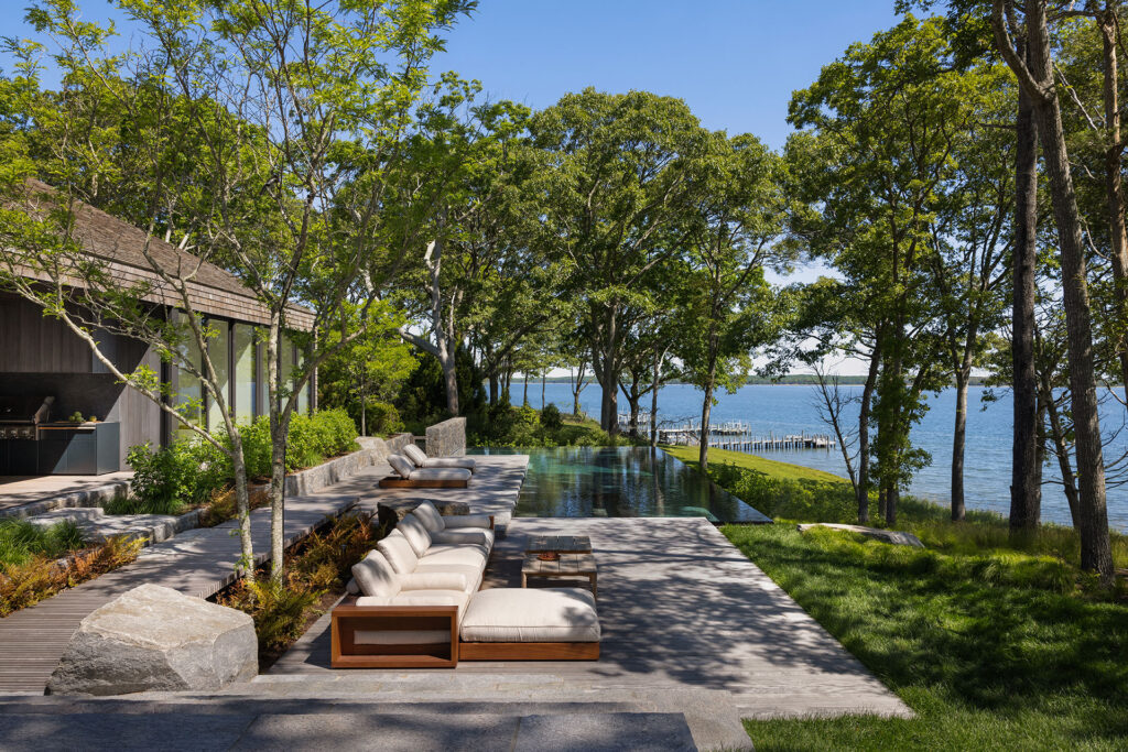 The Bay House — pool terrace overlooking the bay and private dock